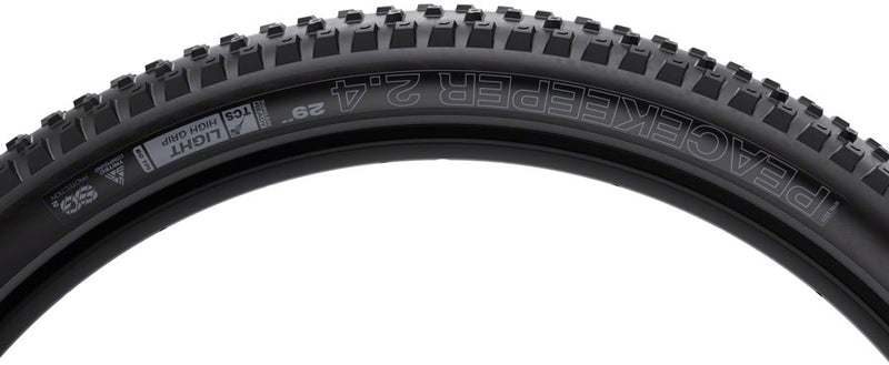 Load image into Gallery viewer, WTB Peacekeeper Tire - 29 x 2.4 TCS Tubeless Folding BLK/Tan Light/Fast Rolling TriTec SG